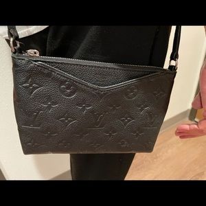 Louis Vuitton crossbody empreinte uniform purse.